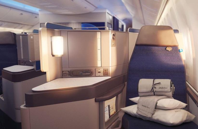 WITH BEDDING supplied by Saks Fifth Avenue, United’s Polaris Business Class has never been more appealing. (photo credit: Courtesy)