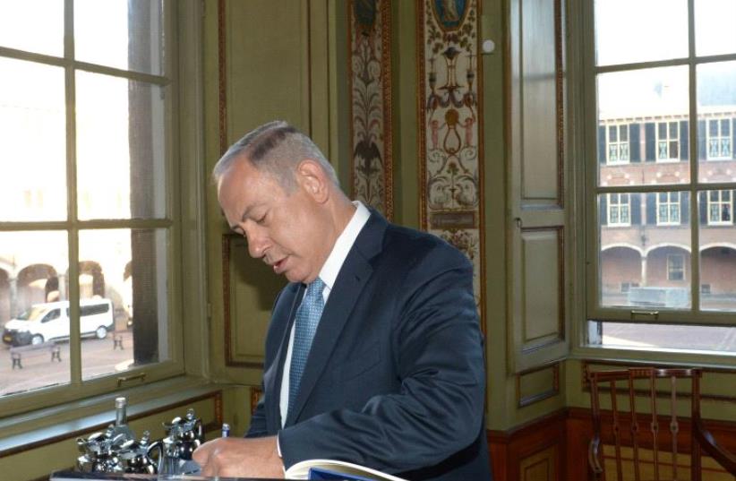 Prime Minister Benjamin Netanyahu at the Dutch Parliament. (photo credit: AMOS BEN-GERSHOM/GPO)