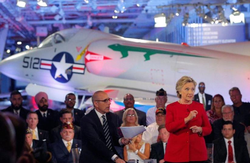 US Democratic presidential candidate Hillary Clinton speaks at a presidential candidates "Commander-in-Chief" forum aboard the decommissioned aircraft carrier "Intrepid" in New York, September 7, 2016 (photo credit: REUTERS)