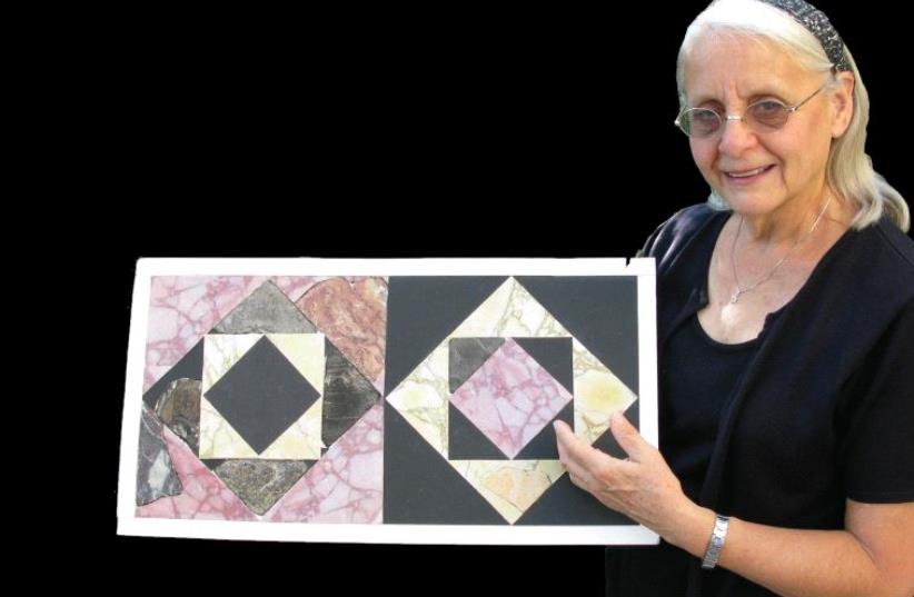 Frankie Snyder holds up an ‘opus sectile’ tile (photo credit: COURTESY OF TEMPLE MOUNT SIFTING PROJECT)
