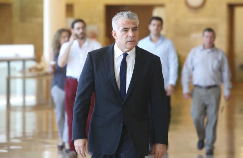 YAIR LAPID at the Knesset in July. The Yesh Atid chairman is perceived to have temporarily benefited from the train scandal. (photo credit: MARC ISRAEL SELLEM/THE JERUSALEM POST)