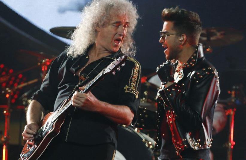 Brian May (L) of the band Queen and Adam Lambert perform during the opening night of their North American tour in Chicago, Illinois, June 19, 2014.  (photo credit: REUTERS/JIM YOUNG)