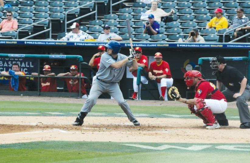Team Israel's Charlie Cutler bats against Spain in the World Baseball Classic qualifying final in 2012 (photo credit: Courtesy)