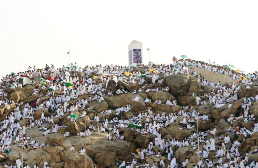 Muslim pilgrims gather on Mount Mercy on the plains of Arafat during the annual haj pilgrimage, outside the city of Mecca this week (photo credit: REUTERS)
