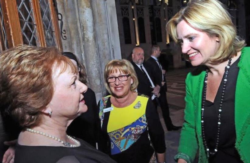 UK HOME SECRETARY Amber Rudd (right) greets British Emunah president Hilary Pearlman. (photo credit: Courtesy)