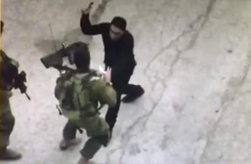 Palestinian terror attack in Hebron (photo credit: screenshot)