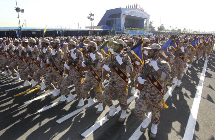 Iranian soldiers march during the annual military parade marking the anniversary of the start of Iran's 1980-1988 war with Iraq, on September 21, 2016, in Tehran (photo credit: CHAVOSH HOMAVANDI / AFP)