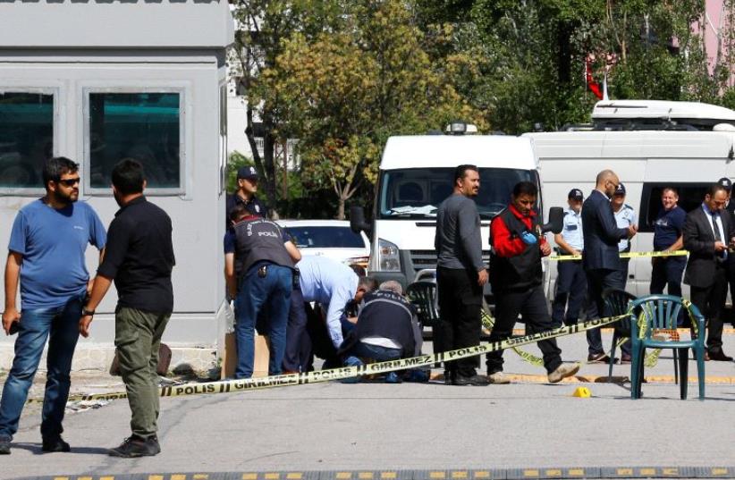 Police forensic experts examine in front of the Israeli Embassy in Ankara, Turkey, September 21, 2016 (photo credit: REUTERS)