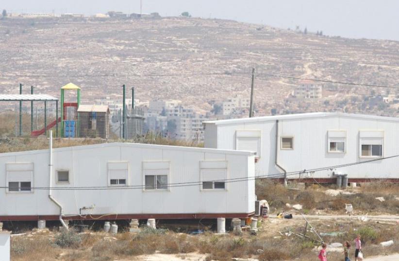 SEVERAL OF THE 40 homes at the Amona outpost, which the High Court has ruled must be removed by December 25. (photo credit: MARC ISRAEL SELLEM/THE JERUSALEM POST)