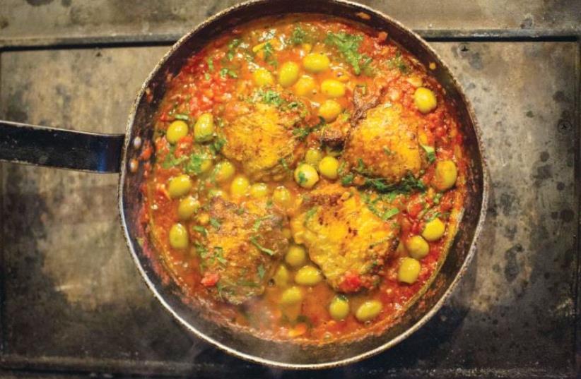 Chicken Thighs in green olive and tomato sauce from ‘The Palomar Cookbook.’ (photo credit: HELEN CATHCART)