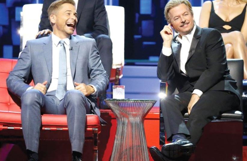 ROAST MASTER David Spade (right) takes aim at Rob Lowe on the ‘Comedy Central Roast of Rob Lowe.’ (photo credit: MICHAEL TRAN/FILMMAGIC)