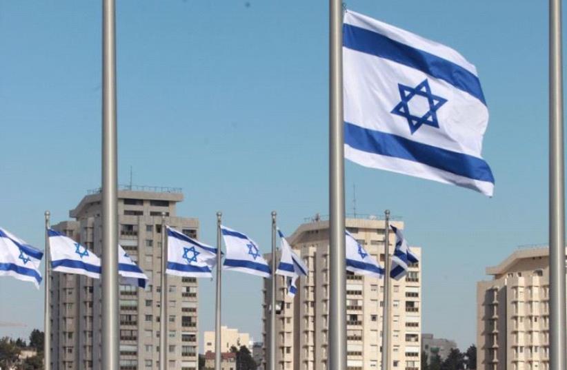 Flags at half staff at Knesset Peres memorial (photo credit: Lahav Harkov)