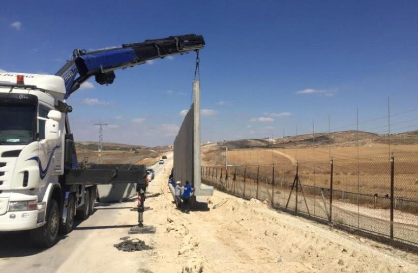 44km of new concrete wall are being built along the Green Line west of Hebron to prevent terror infiltration in an area known as a porous section of border (photo credit: SETH J. FRANTZMAN)