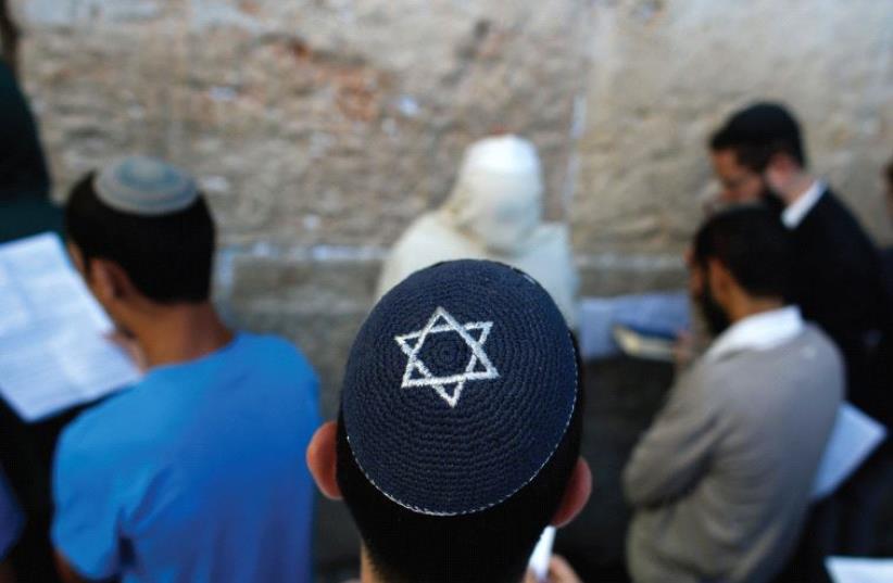 LET THEM feel welcome. The author argues that the Israel rabbinate’s behavior is unhalachic and Jews are suffering as a result. (photo credit: REUTERS)