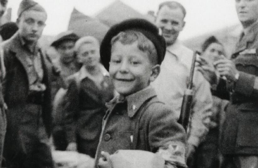 Liberated: The eight-year-old Lau, then known as ‘Lulek,’ leaves the Buchenwald concentration camp in 1945 (photo credit: Courtesy)