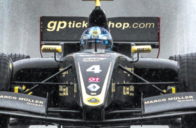 Driving for Team Lotus, Roy Nissany rounds the track under wet conditions (photo credit: Courtesy)