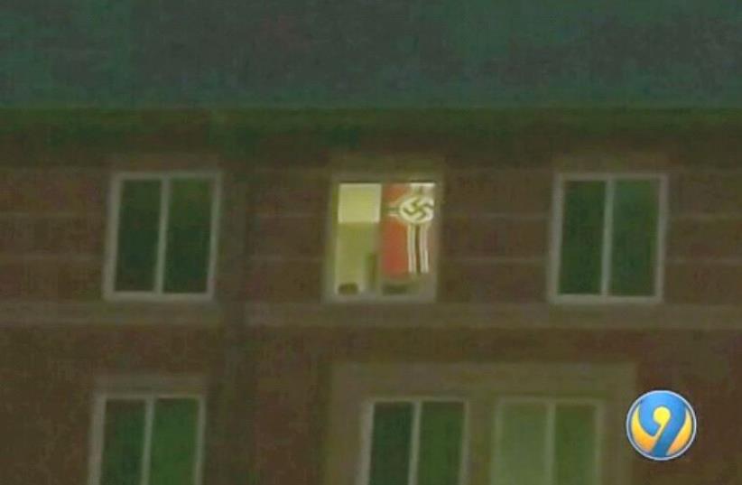 Nazi flag in a dorm room window at University of North Carolina at Charlotte (photo credit: screenshot)