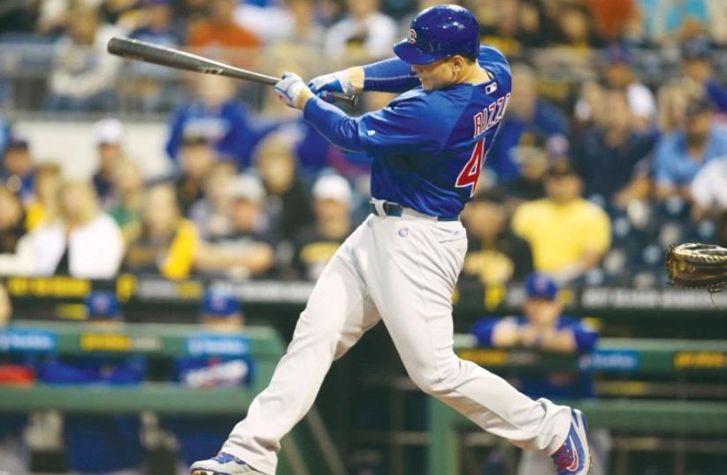 Chicago Cubs first baseman Anthony Rizzo (44) hits a solo home run against the Pittsburgh Pirates during the first inning at PNC Park (photo credit: REUTERS)