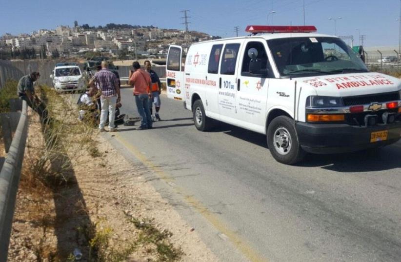 MDA on the scene at the a-Zaim checkpoint  (photo credit: MAGEN DAVID ADOM)