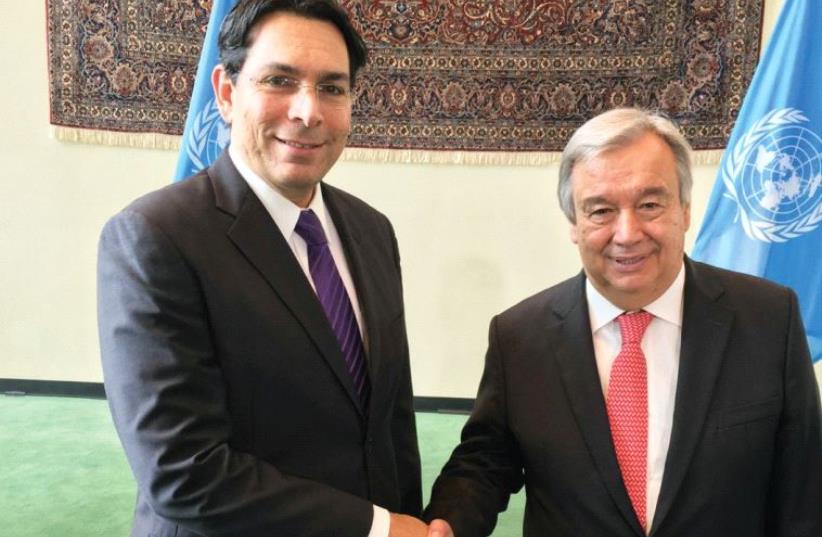 AMBASSADOR DANNY DANON shakes hands with incoming UN Secretary-General Antonio Guterres in New York yesterday (photo credit: ISRAEL MISSION TO THE UN)