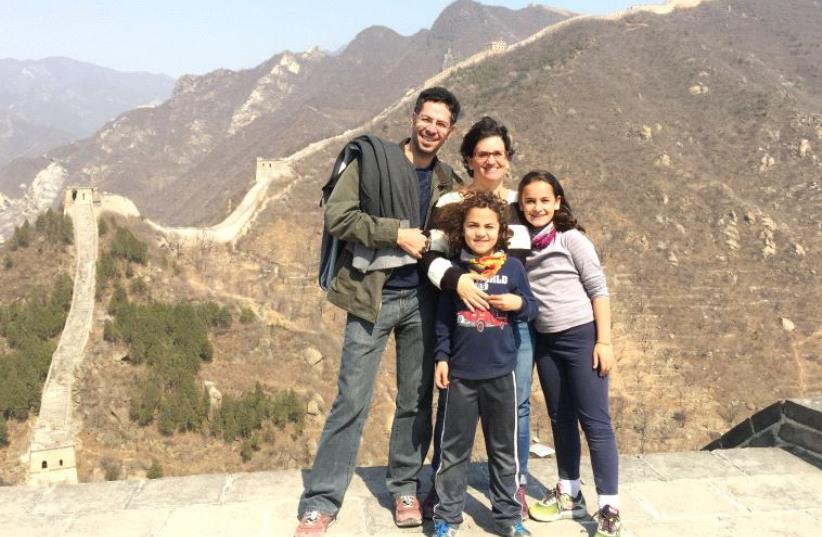 Of living in China as an Israeli, Shahar Twito, seen with his family in front of the country’s iconic Great Wall, explains “the Chinese appreciate the hardships [we] face and our intellect.” (photo credit: Courtesy)