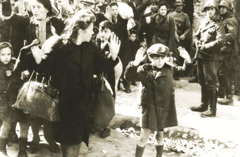 Jews forced out of bunkers by SS police during the Warsaw Ghetto uprising in 1943 (photo credit: Wikimedia Commons)