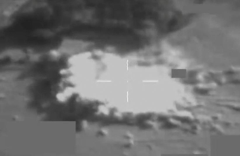 A still image taken from video released October 20, 2016 shows a British Royal Air Force Typhoon jet using a Paveway IV guided bomb to destroy a large IS truck-bomb south of Mosul, Iraq, on October 17, 2016. (photo credit: REUTERS)