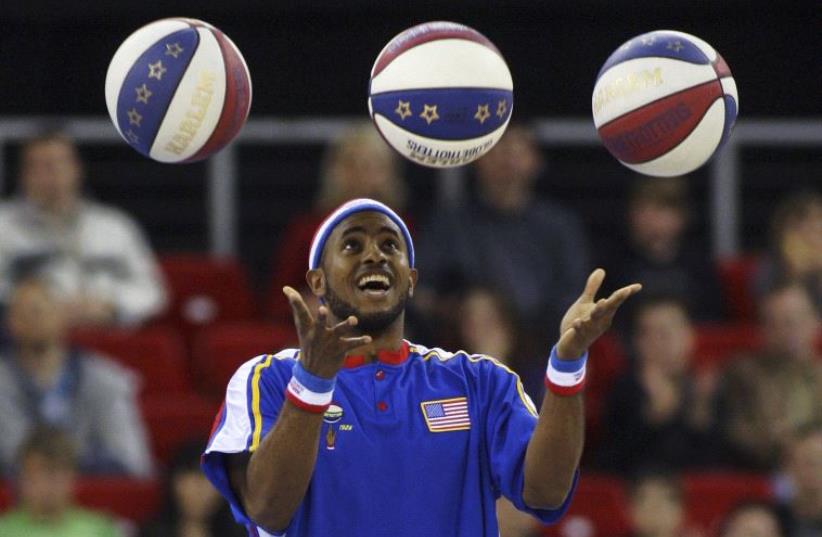 A member of the Harlem Globetrotters basketball team. (photo credit: REUTERS)
