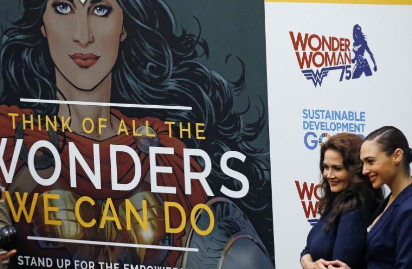 Actors Gal Gadot and Lynda Carter pose for photos during an event to name Wonder Woman UN Honorary Ambassador for the Empowerment of Women and Girls at the United Nations Headquarters in New York, October 21, 2016 (photo credit: REUTERS)