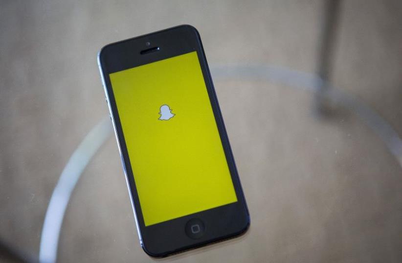 A portrait of the Snapchat logo (photo credit: REUTERS)