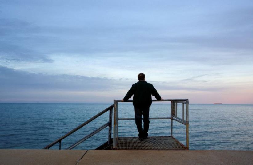 A man looking at the sea (illustrative) (photo credit: ING IMAGE/ASAP)