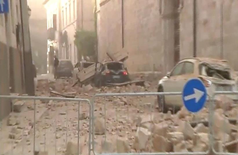 Destroyed cars under rubbles after an 6.6 magnitude earthquake on October 30, 2016 in Norcia (photo credit: HO / AFP)