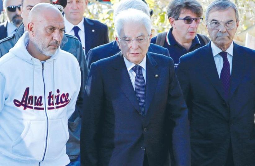 ITALIAN PRESIDENT Sergio Mattarella (center) visits the town of Amatrice in August after the earthquake. (photo credit: REUTERS)