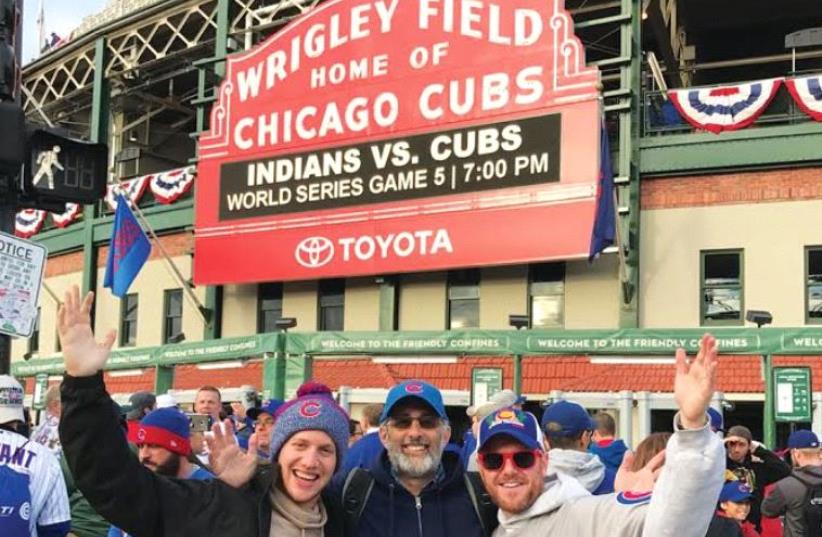 Author Stewart Weiss (center) on his way into Wrigley Field for Game 5 of the World Series. (photo credit: KAREN ROBINS)