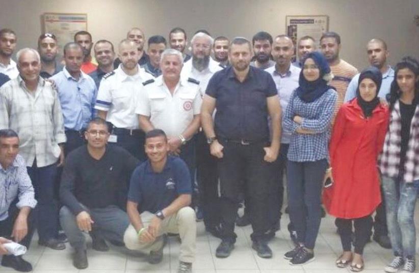 PARTICIPANTS IN Magen David Adom’s first course for emergency medicine providers for the Negev Beduin community pose yesterday at the MDA’s Beersheba branch. (photo credit: MDA)