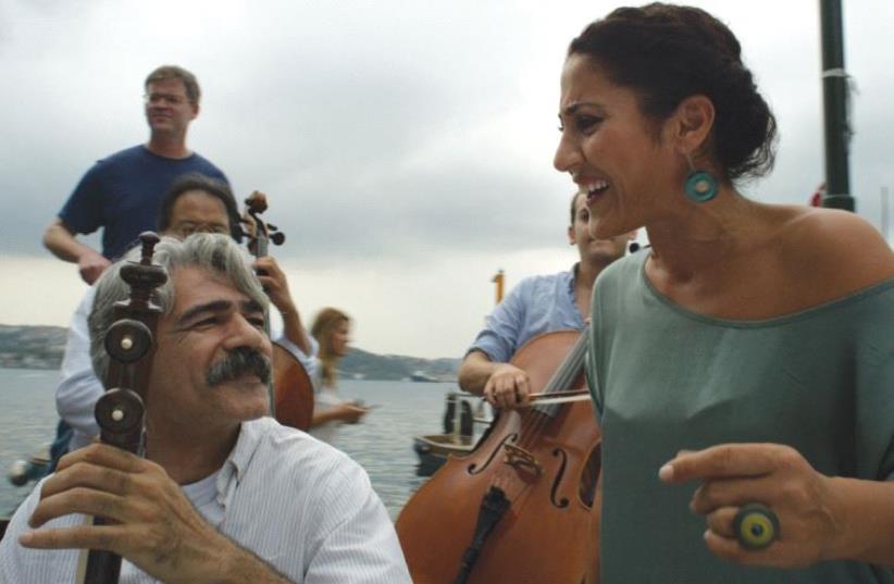 Iranian kamanche player Kayhan Kalhor and Turkish singer Aynur Dogan find a common musical language in the Silk Road Ensemble (photo credit: THE ORCHARD)