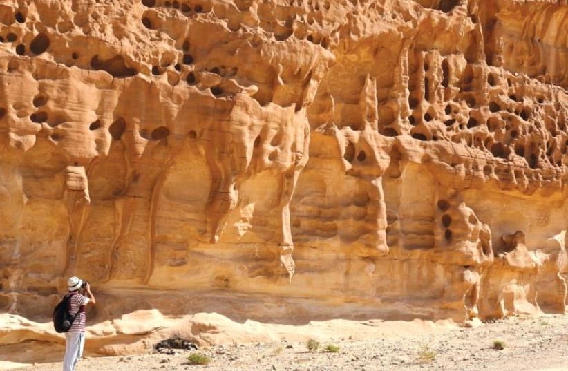 VACATION SPOT? A hiker takes a photo in the White Canyon area in South Sinai, Egypt, last year. (photo credit: REUTERS)