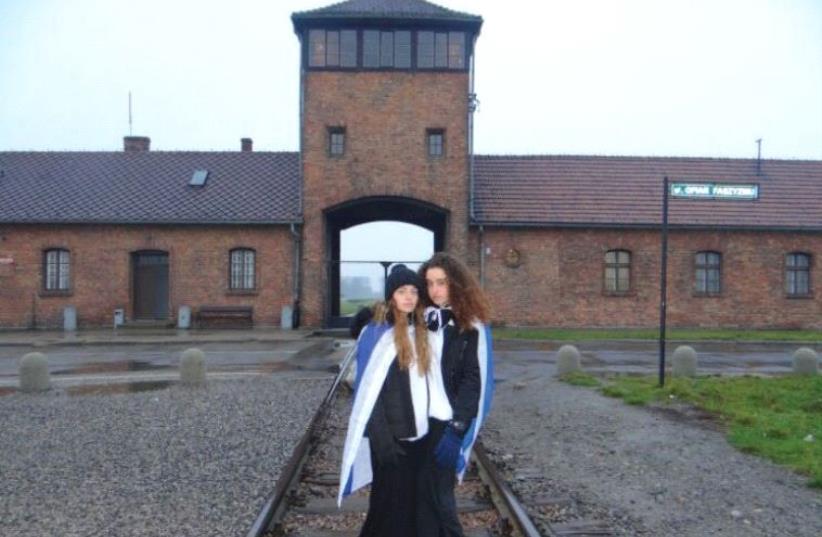 ABIGAIL LEIBLER and No’a Ehrman-Loebenberg on a trip to Birkenau, earlier this month (photo credit: REUTERS)