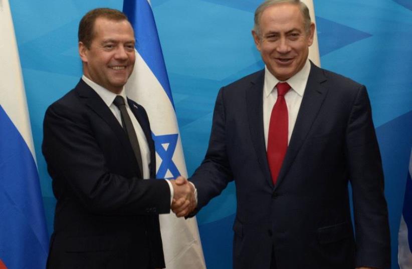 Israeli Prime Minister Benjamin Netanyahu holding talks with Russian Prime Minister Dmitry Medvedev. (photo credit: GPO/AMOS BEN GERSHOM)