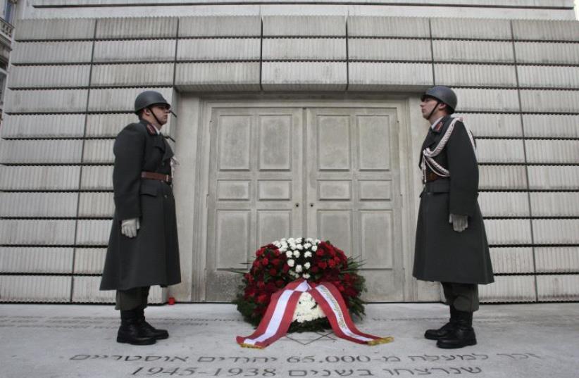 Members of the guard of honour stand in front of the memorial commemorating Holocaust victims on Judenplatz in Vienna November 8, 2013. November 9th marks the 75th anniversary of the 'Kristallnacht'  (photo credit: REUTERS)