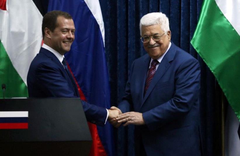PA President Abbas with Russian PM Medvedev (photo credit: REUTERS)
