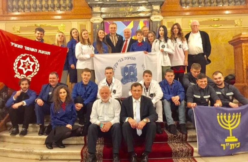  Zionist Youth Movements in the Lviv Opera with Lviv Mayor Andriy Sadovoy (back row, center left) and Limmud FSU Founder Chaim Chesler (back row, center right. (photo credit: BORIS BUKHMAN)