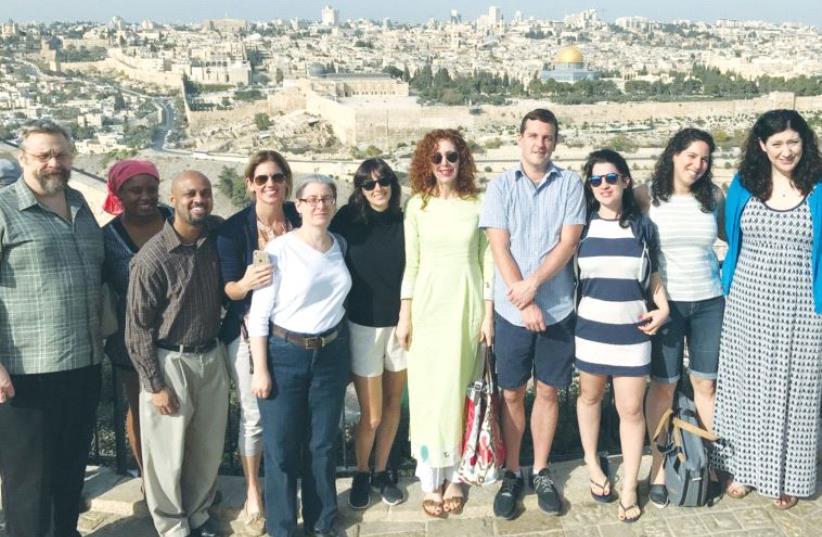 A MASA-ORGANIZED delegation here to explore internship opportunities for US university students poses for a picture on Sunday with Jerusalem’s Old City as a backdrop. (photo credit: Courtesy)