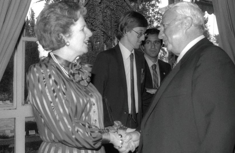 THEN-British prime minister Margaret Thatcher, who the author refers to as a ‘philosemite,’ greets Ariel Sharon during a reception in Jerusalem in May 1986 (photo credit: REUTERS)