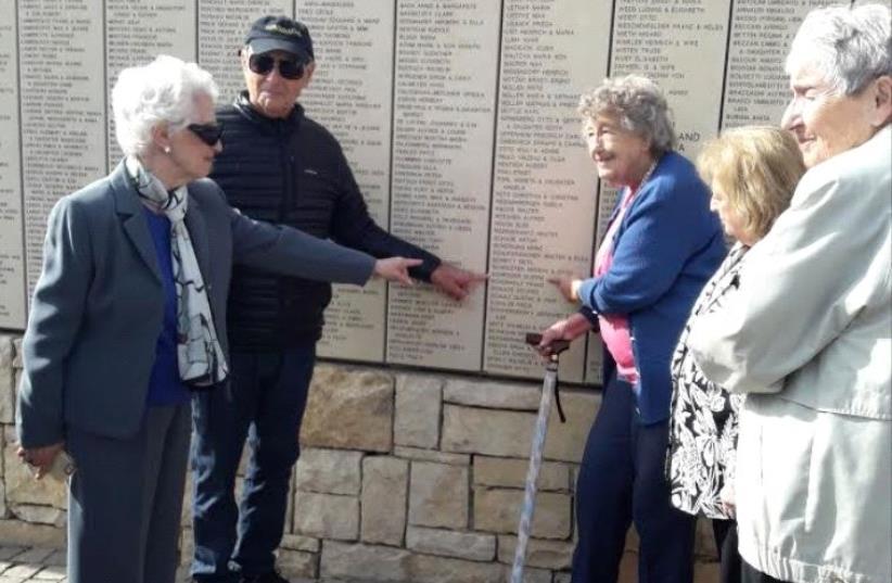 SS. St Louis survivors point to Captain Gustav Schröder's name on the Wall of Honor in the Garden of the Righteous Among the Nations  (photo credit: TAMARA ZIEVE)