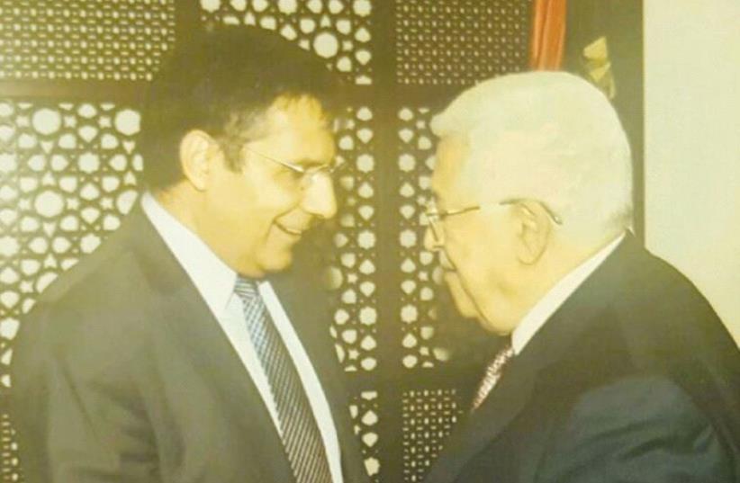 ZIONIST UNION MK Yossi Yonah (left) and PA President Mahmoud Abbas shake hands at the Mukata presidential compound in Ramallah (photo credit: Courtesy)