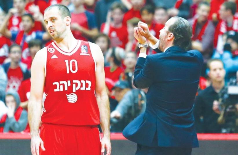 Hapoel Jerusalem guard Yotam Halperin (left) and coach Simone Pianigiani (photo credit: DANNY MARON)