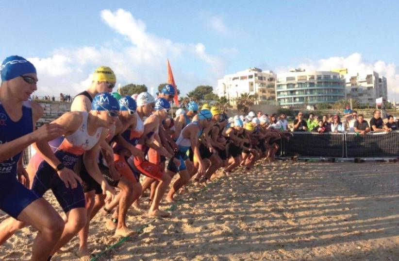 Athletes are poised for action at the starting line of one of the three stages of the Eilat Triathlon (photo credit: ISRAEL TRIATHLON)