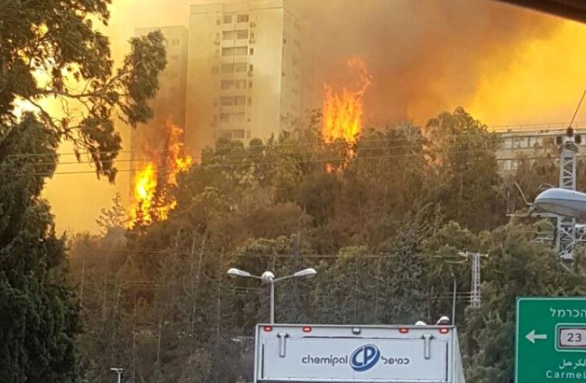 Buildings ablaze in Haifa (photo credit: AVSHALOM SASSONI)