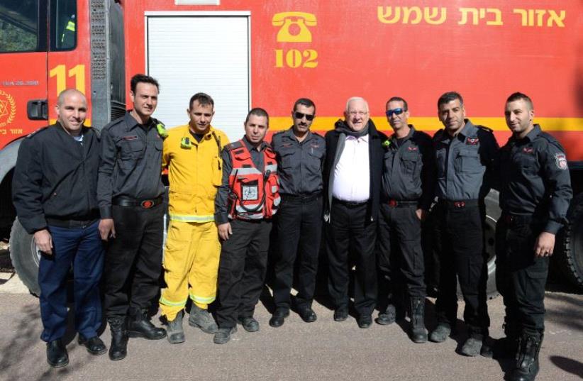 President Rivlin meets firefighters at Nataf (photo credit: Mark Neiman/GPO)